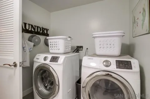 a picture of a bathroom with a white wall