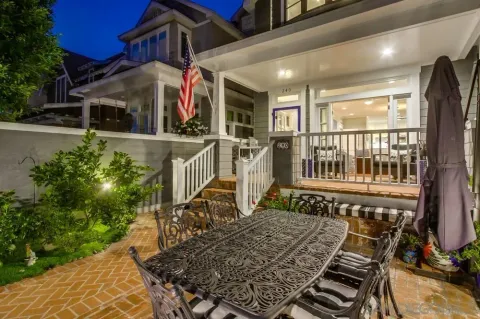 a patio with a table and chairs