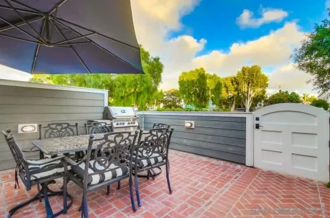 a view of swimming pool with outdoor seating and plants