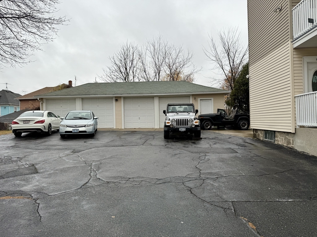 142 Cote Avenue Woonsocket, RI 02895 - Photo 19 of 22 a car parked in front of white house