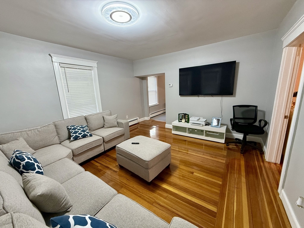 142 Cote Avenue Woonsocket, RI 02895 - Photo 5 of 22 a living room with furniture and a flat screen tv