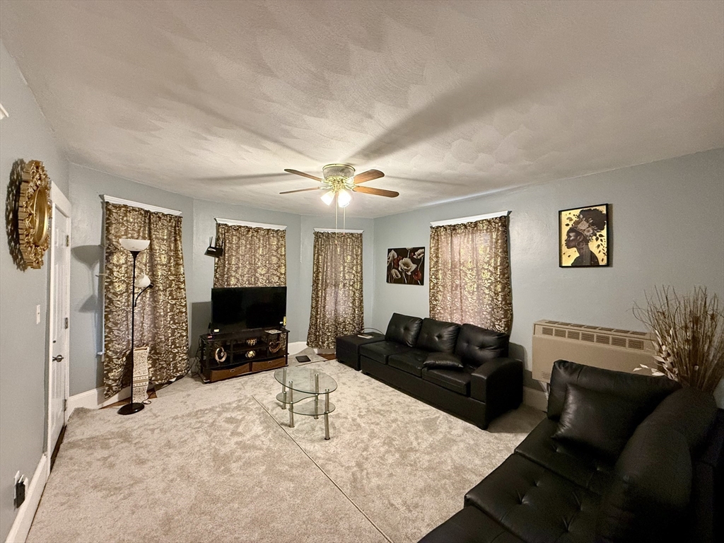 142 Cote Avenue Woonsocket, RI 02895 - Photo 7 of 22 a living room with furniture and a flat screen tv