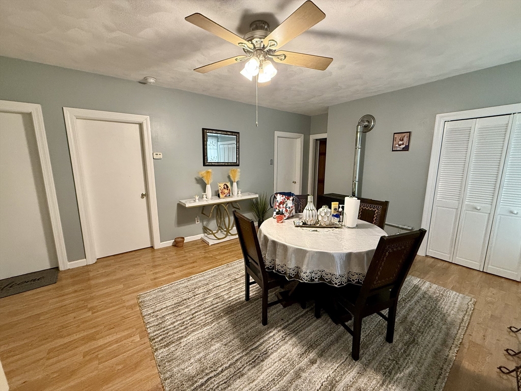 142 Cote Avenue Woonsocket, RI 02895 - Photo 8 of 22 a view of a dining room with furniture and wooden floor