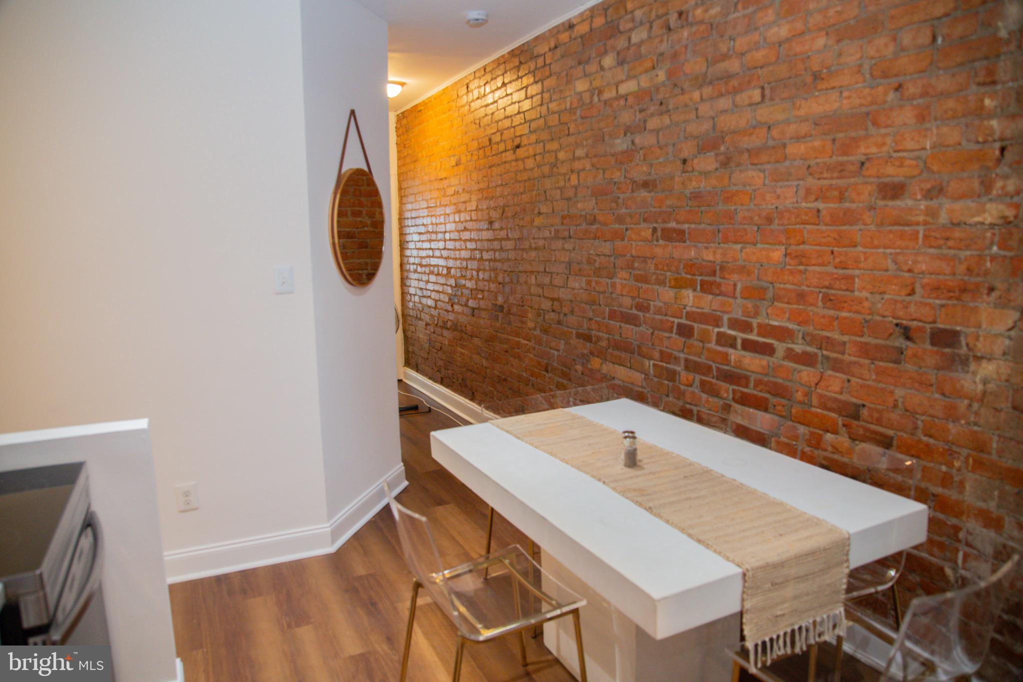 1345 1st Street Northwest, Unit 2 Washington, DC 20001 - Photo 4 of 11 Charming dining nook with exposed brick wall.