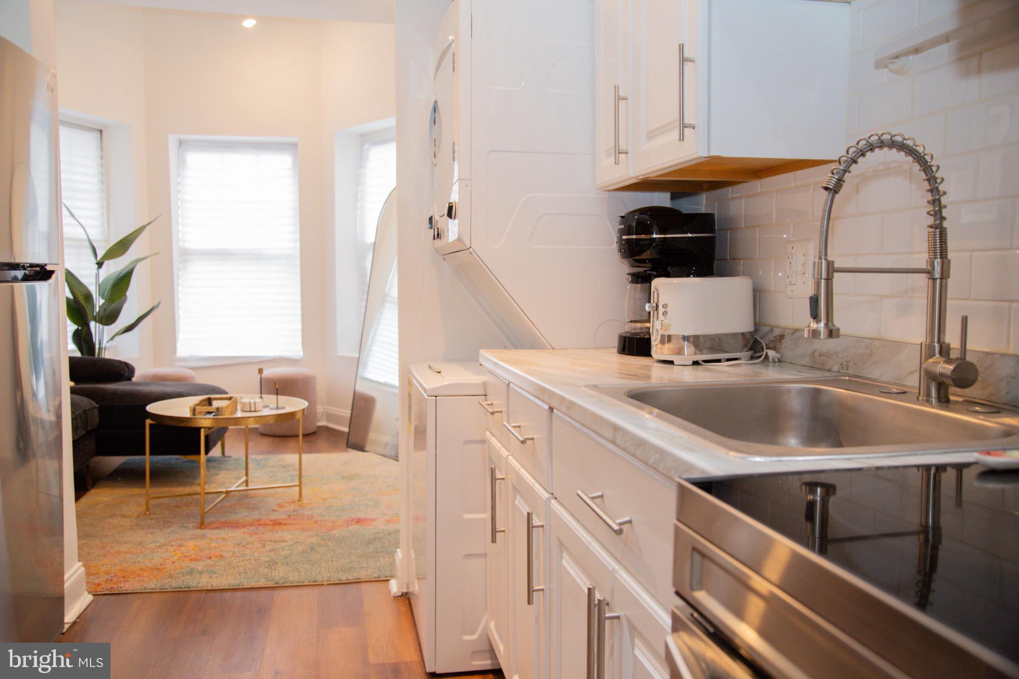 1345 1st Street Northwest, Unit 2 Washington, DC 20001 - Photo 5 of 11 Modern kitchen with natural light.