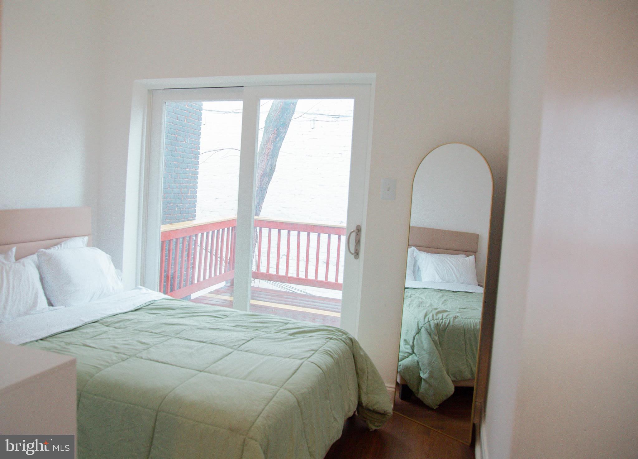 1345 1st Street Northwest, Unit 2 Washington, DC 20001 - Photo 10 of 11 Bright and airy bedroom with balcony views.
