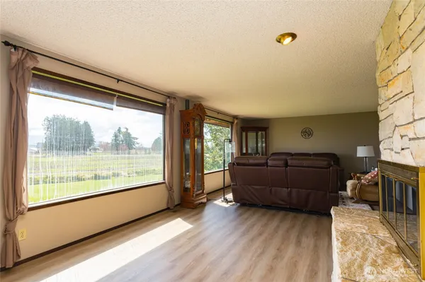 a kitchen with stainless steel appliances kitchen island granite countertop a refrigerator and a sink