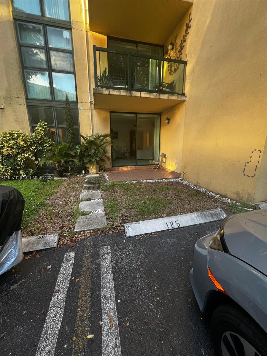 11750 Southwest 18th Street, Unit 1251 Miami, FL 33175 - Photo 15 of 15 a front view of a house with a yard