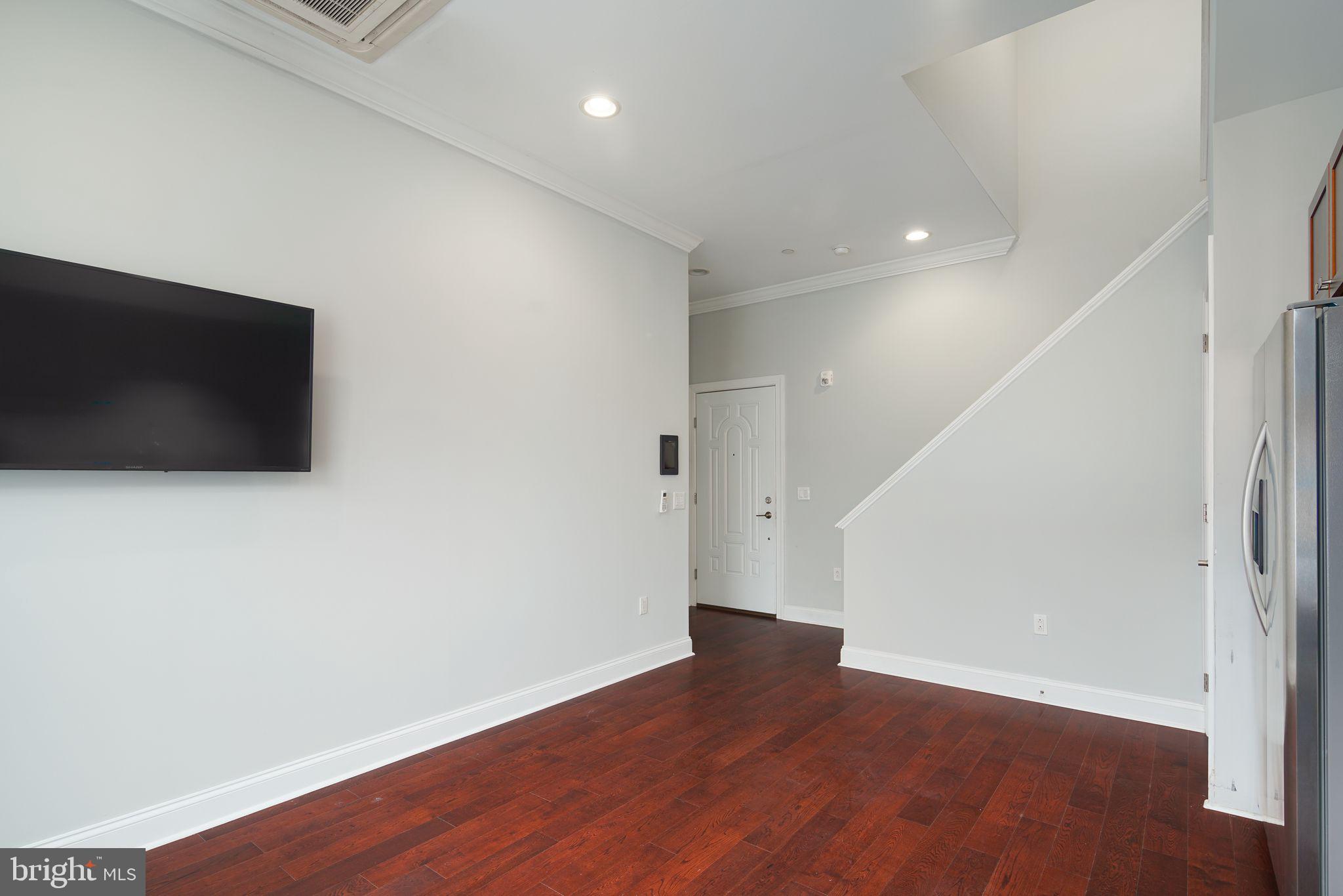 901 North Front Street, Unit 5 Philadelphia, PA 19123 - Photo 9 of 12 a view of a livingroom with wooden floor