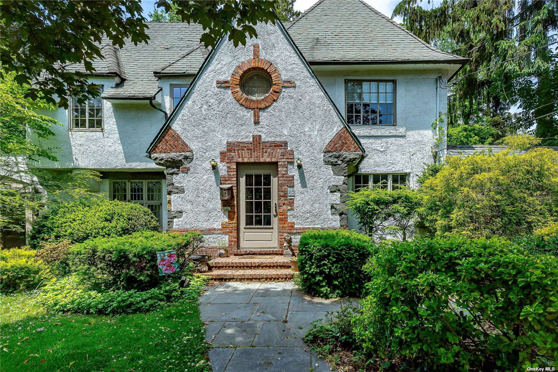 20 Ascot Ridge Great Neck, NY 11021 - Photo 1 of 1 front view of a house with a yard