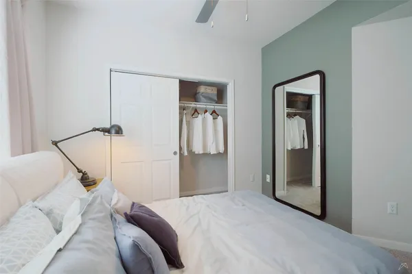 a bedroom with a bed and closet