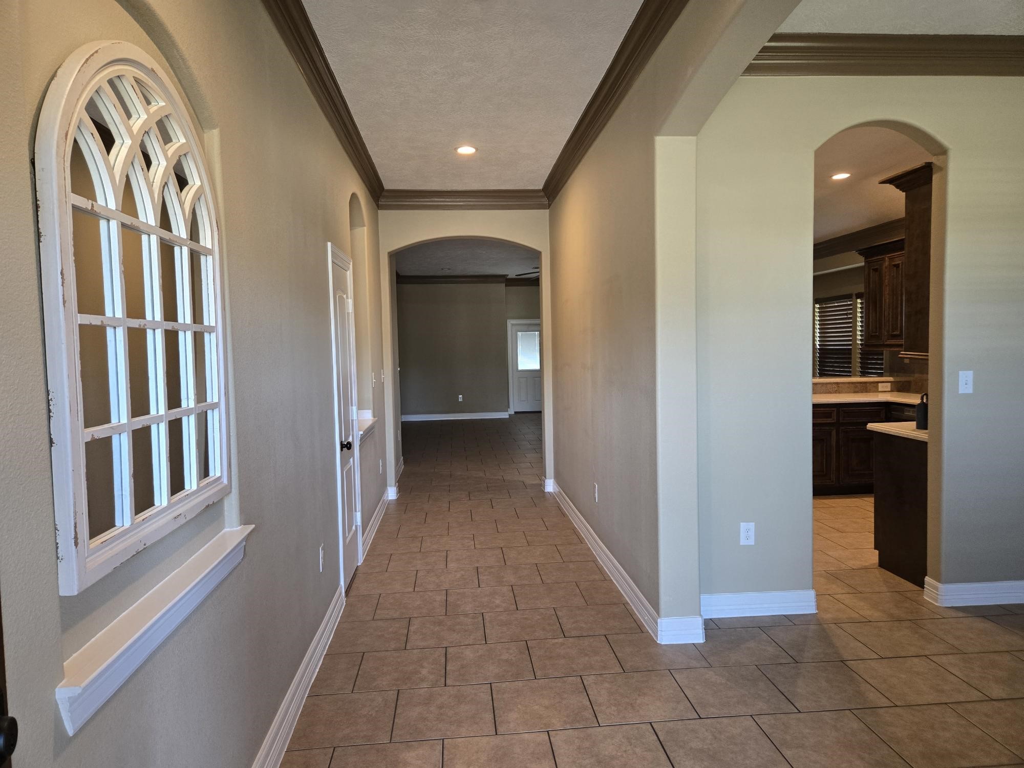 306 Masterson Street Arcola, TX 77583 - Photo 6 of 28 a view of a hallway with wooden floor and a living room