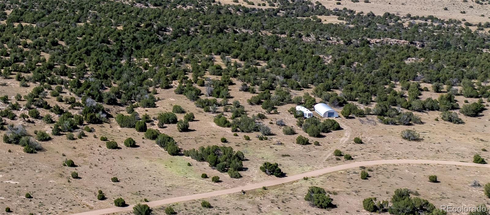 Ridge Road West Rye, CO 81069 - Photo 12 of 30 a view of a dry yard covered with snow in the background