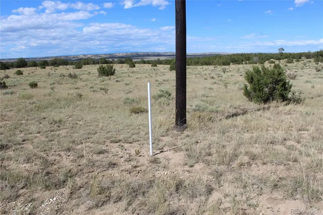 a view of an empty room and mountain view
