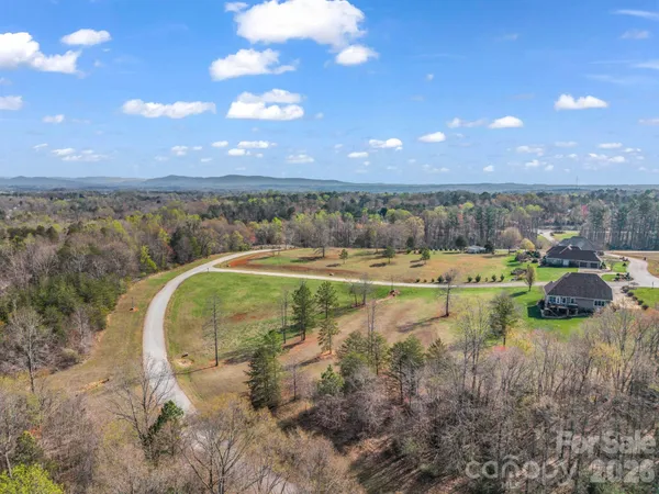 a view of a water fountain and a big yard