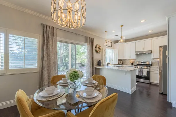a kitchen with a table and chairs in it