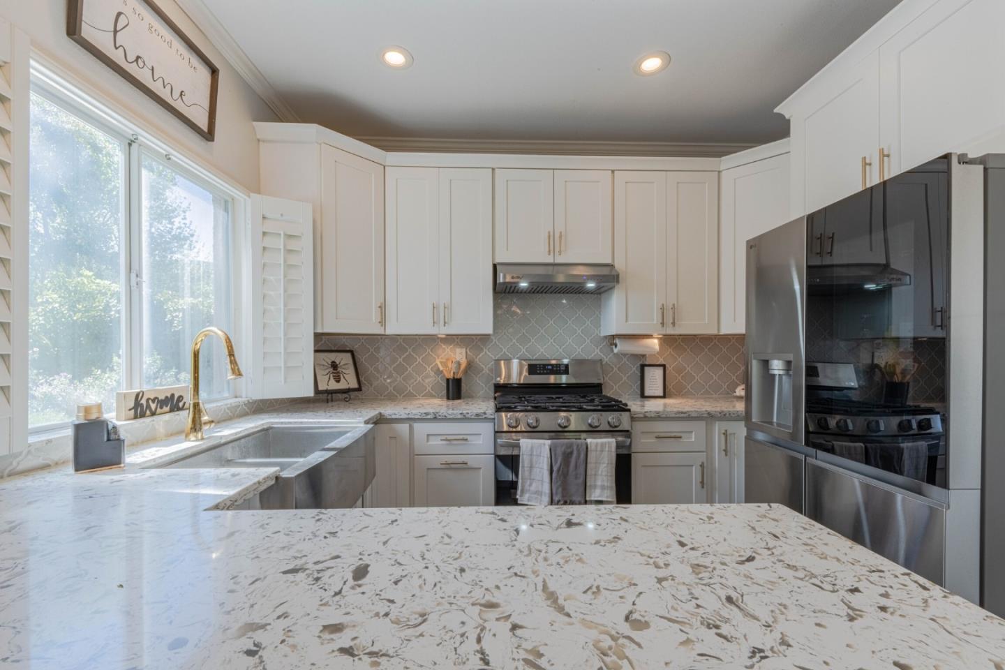 25215 Azalea Court Salinas, CA 93908 - Photo 20 of 48 a kitchen with stainless steel appliances kitchen island granite countertop a refrigerator stove top oven and sink
