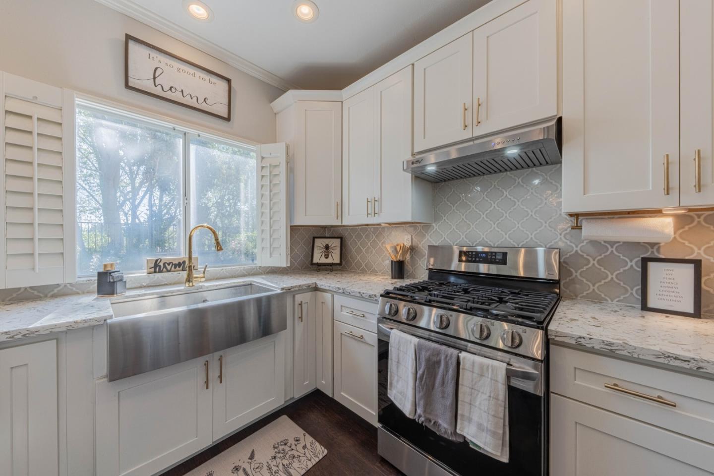 25215 Azalea Court Salinas, CA 93908 - Photo 21 of 48 a kitchen with stainless steel appliances granite countertop a sink stove and cabinets