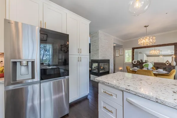a view of a room with wooden floor staircase and windows