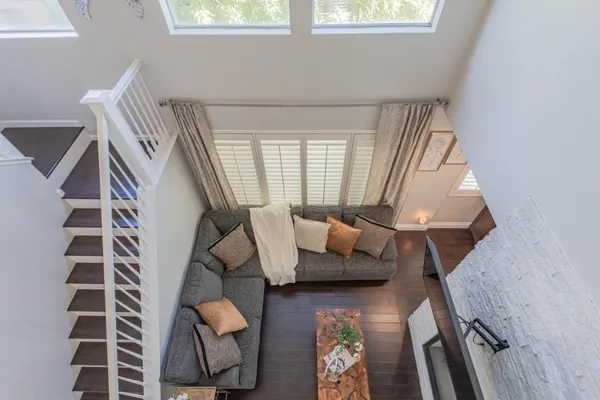 a bed sitting in a bedroom next to a window