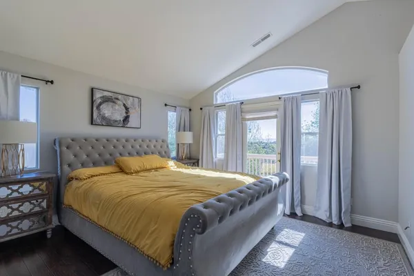 a view of a balcony with chair and the floor to ceiling window