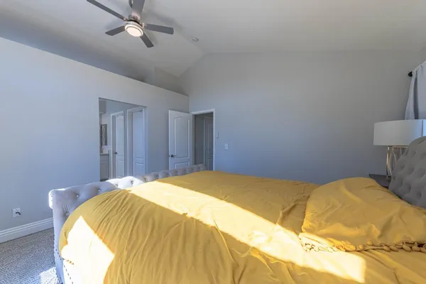 a spacious bathroom with a double vanity sink a large mirror and a bathtub