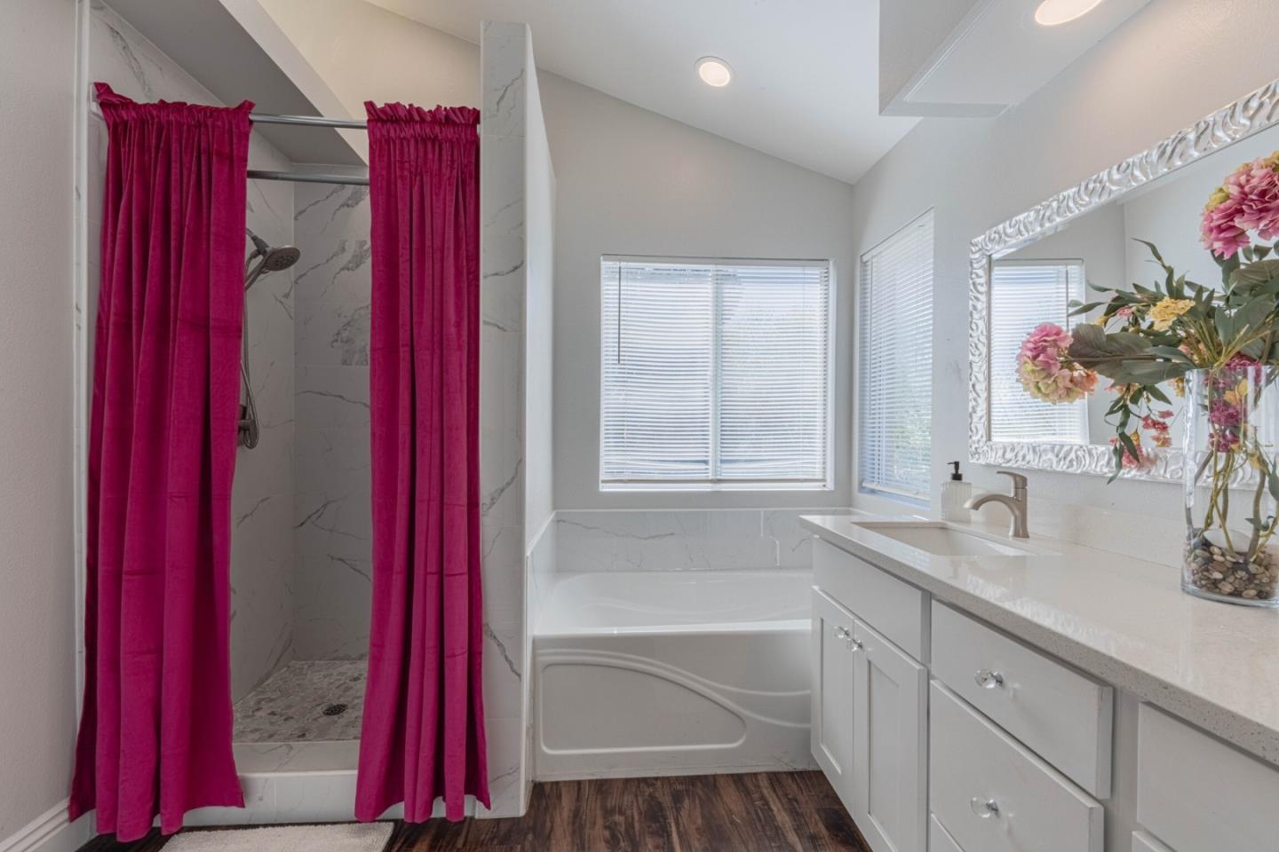 25215 Azalea Court Salinas, CA 93908 - Photo 33 of 48 a bathroom with a tub sink and mirror