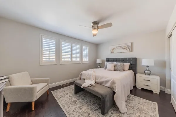 a bedroom with a bed and pillows