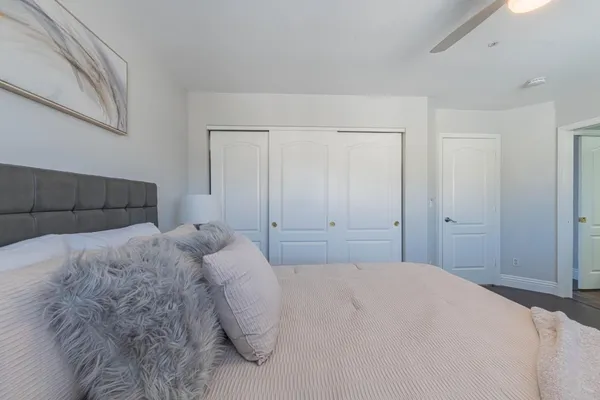 a bedroom with a bed and a desk