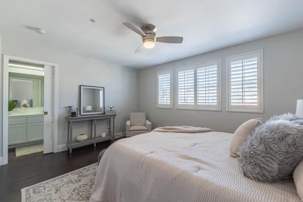 a bathroom with a toilet a sink and a mirror