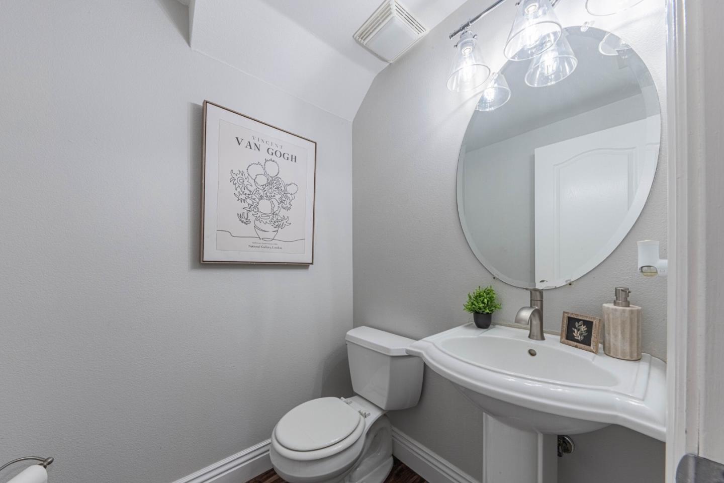 25215 Azalea Court Salinas, CA 93908 - Photo 43 of 48 a bathroom with a toilet a sink and a mirror