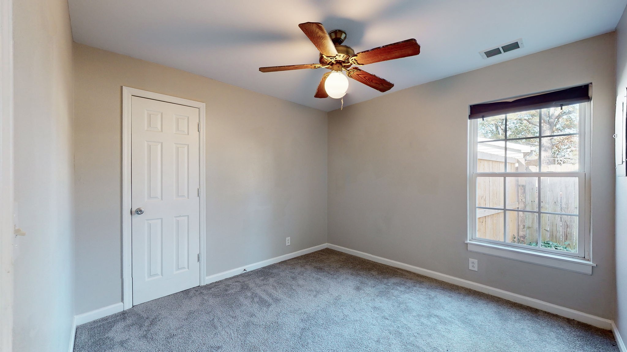 253 Warrior Road Madison, TN 37115 - Photo 12 of 43 an empty room with windows and fan