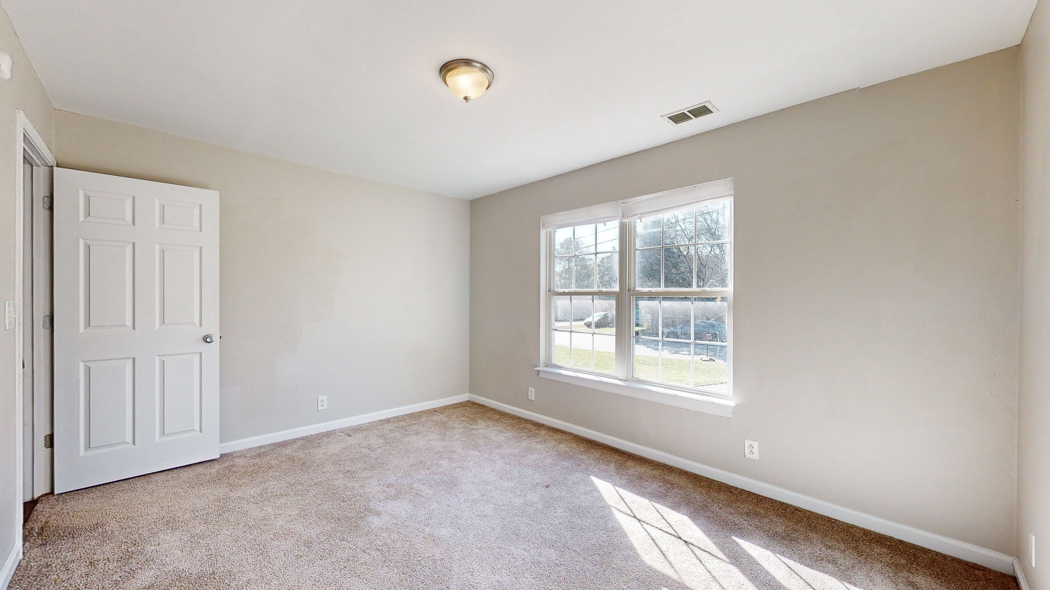 253 Warrior Road Madison, TN 37115 - Photo 17 of 43 a view of an empty room with a window