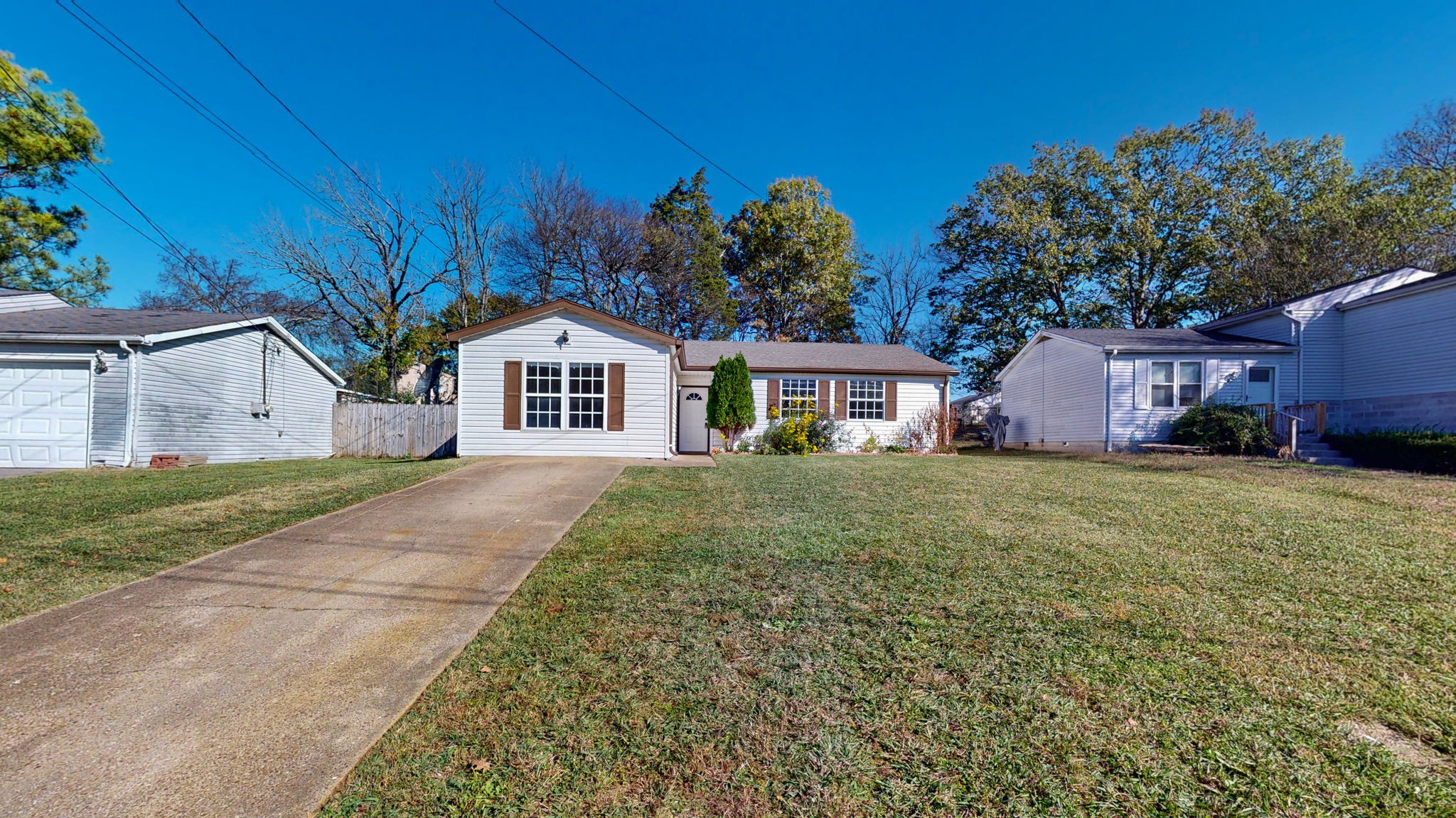 253 Warrior Road Madison, TN 37115 - Photo 2 of 43 a front view of a house with garden
