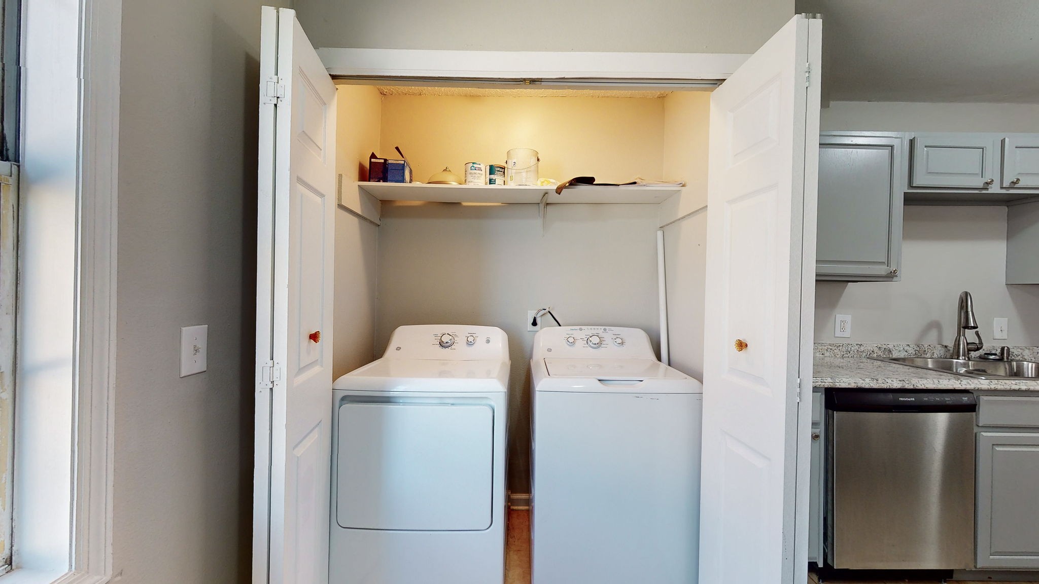 253 Warrior Road Madison, TN 37115 - Photo 29 of 43 a utility room with cabinets washer and dryer
