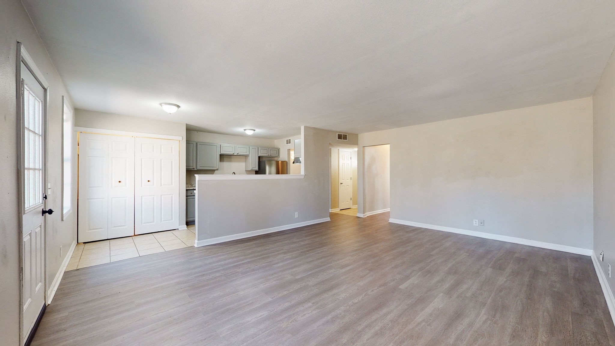 253 Warrior Road Madison, TN 37115 - Photo 8 of 43 a view of an empty room with wooden floor and a window
