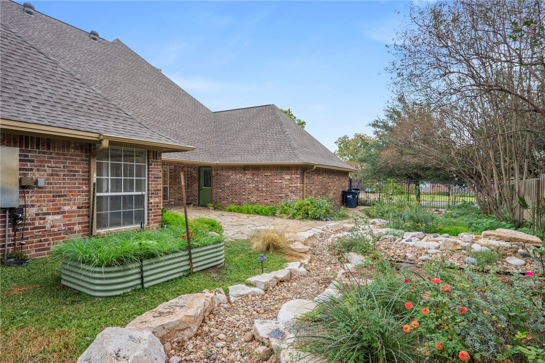 713 Willow Loop College Station, TX 77845 - Photo 33 of 39 a view of a house with a yard and large tree