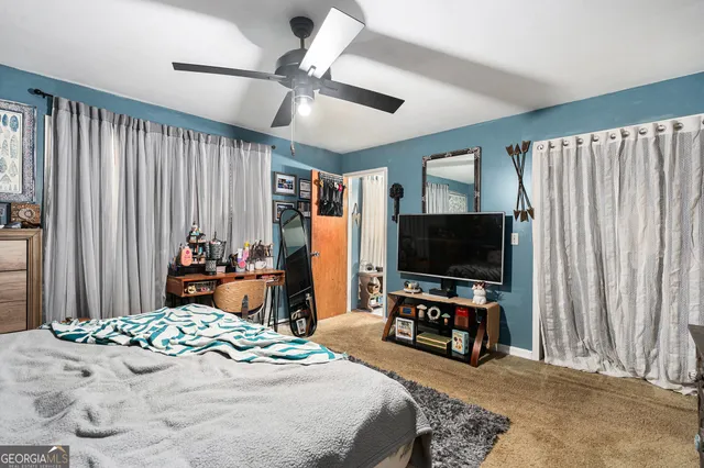a bathroom with a toilet a sink and a mirror