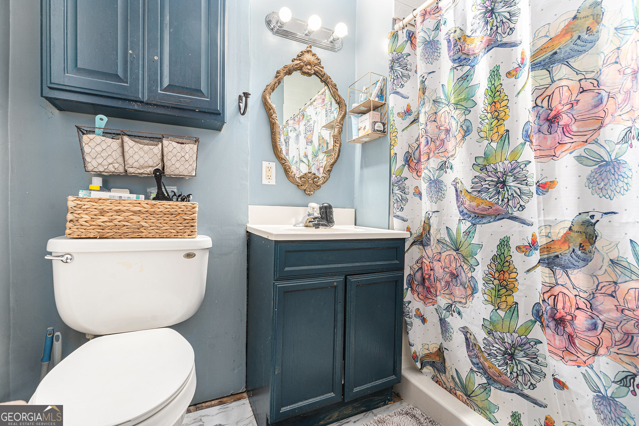 292 Musella Road Musella, GA 31066 - Photo 20 of 29 a bathroom with a toilet a sink and a mirror