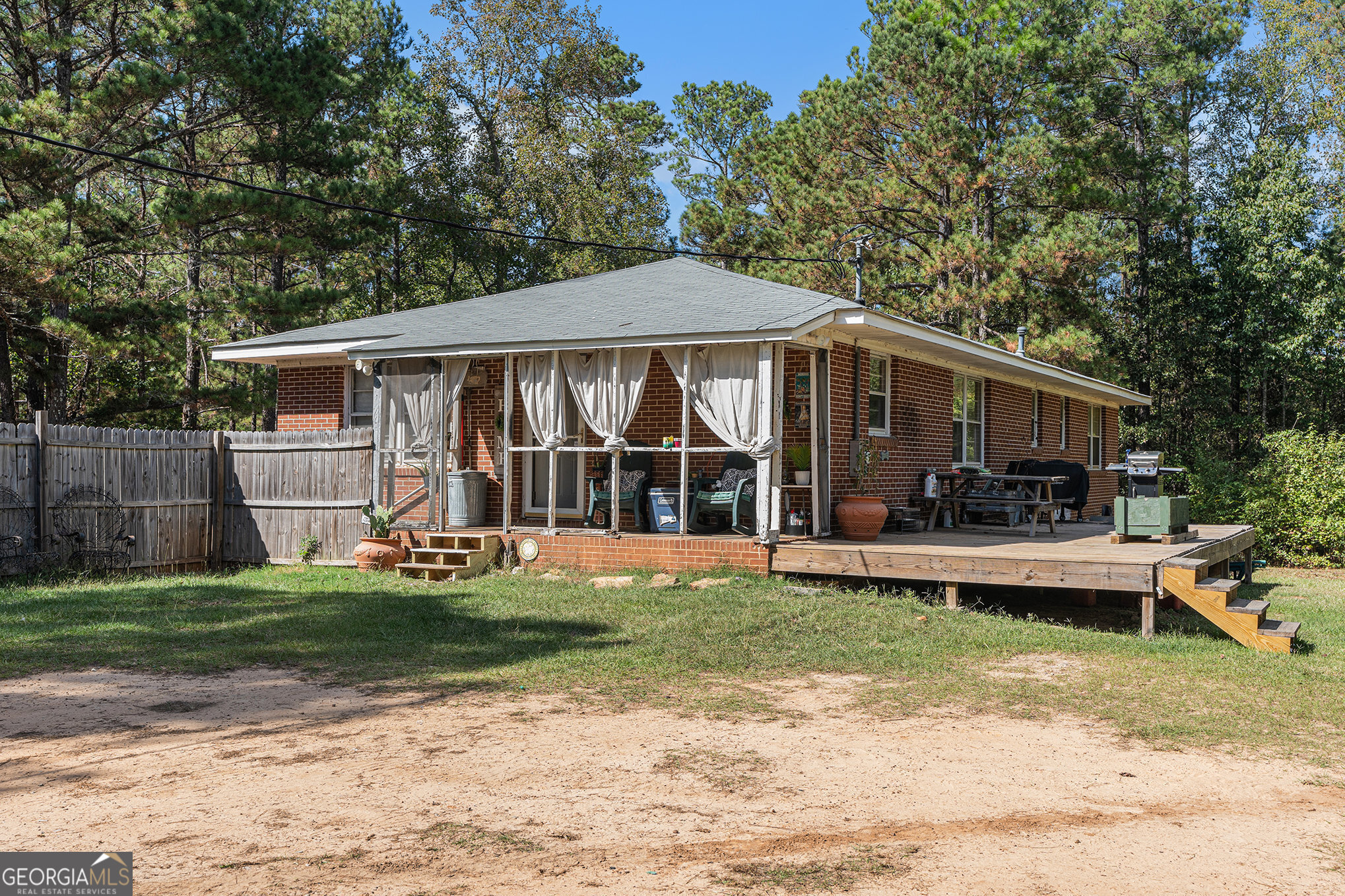 292 Musella Road Musella, GA 31066 - Photo 27 of 29 a view of a house with backyard sitting area and garden
