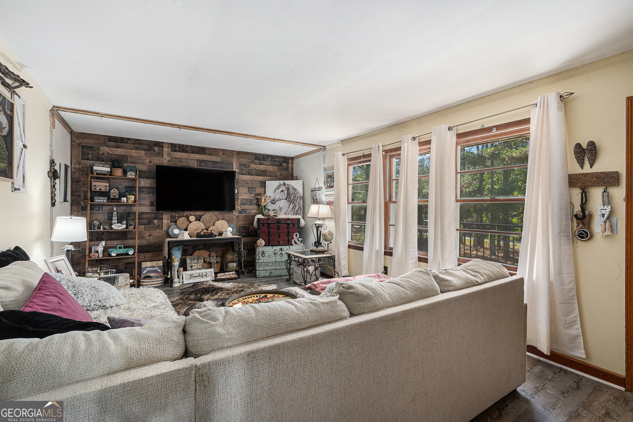 292 Musella Road Musella, GA 31066 - Photo 8 of 29 a living room with furniture and a flat screen tv