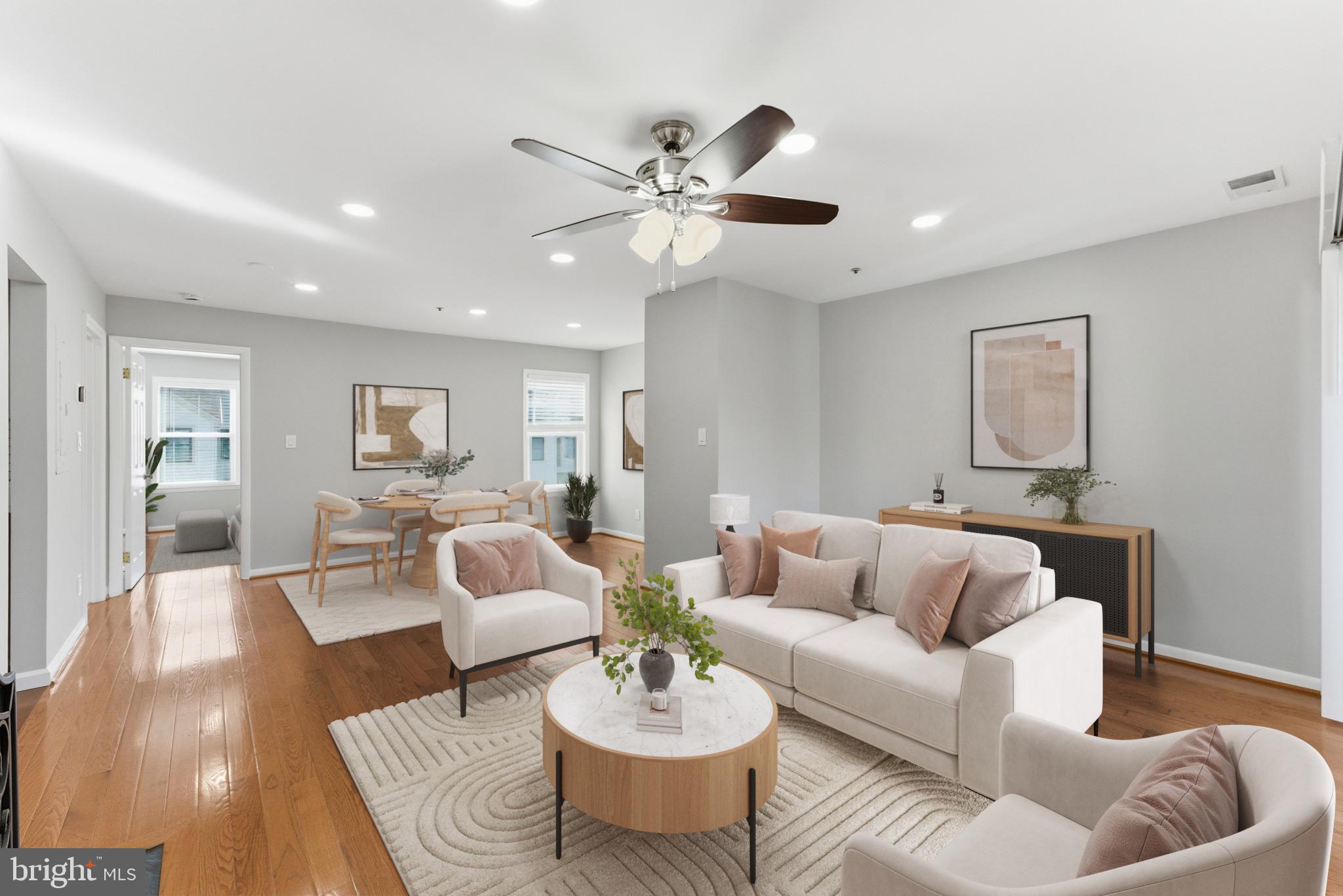 13406 Shady Knoll Drive, Unit 305 Silver Spring, MD 20904 - Photo 11 of 37 a living room with furniture and a large window