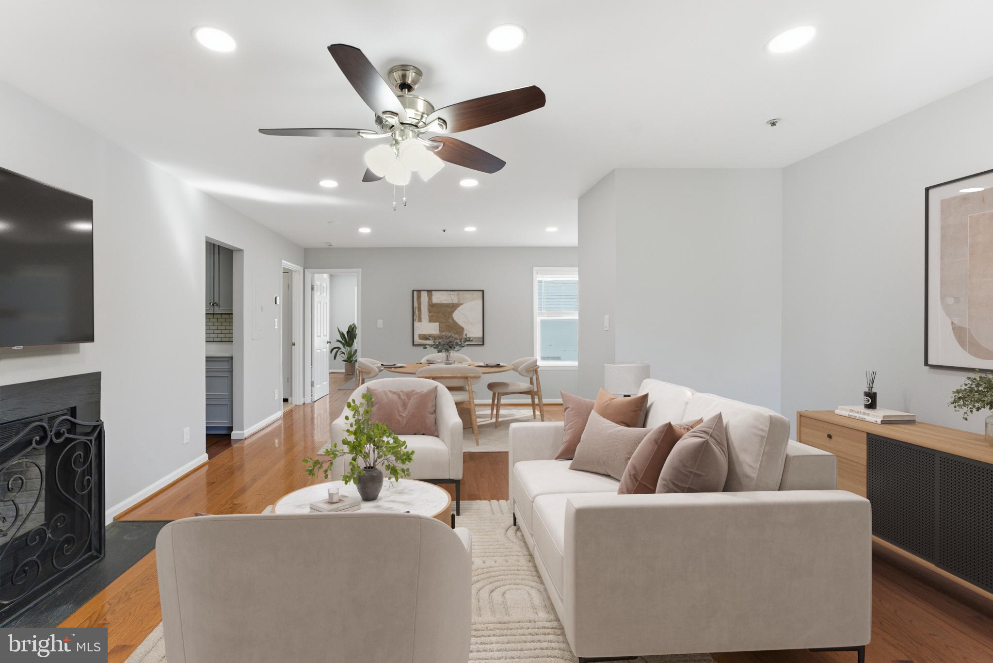 13406 Shady Knoll Drive, Unit 305 Silver Spring, MD 20904 - Photo 16 of 37 a living room with furniture and a flat screen tv