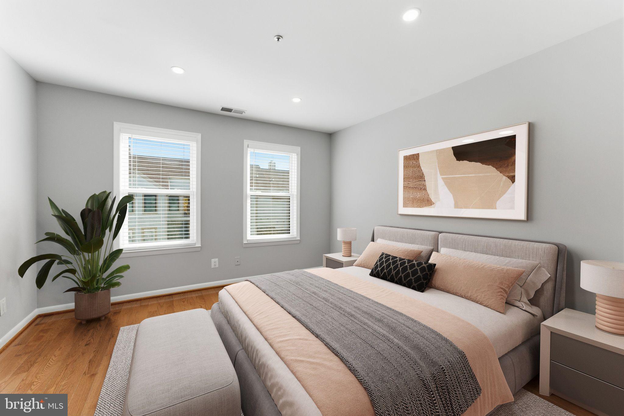 13406 Shady Knoll Drive, Unit 305 Silver Spring, MD 20904 - Photo 25 of 37 a bedroom with a large bed and a window