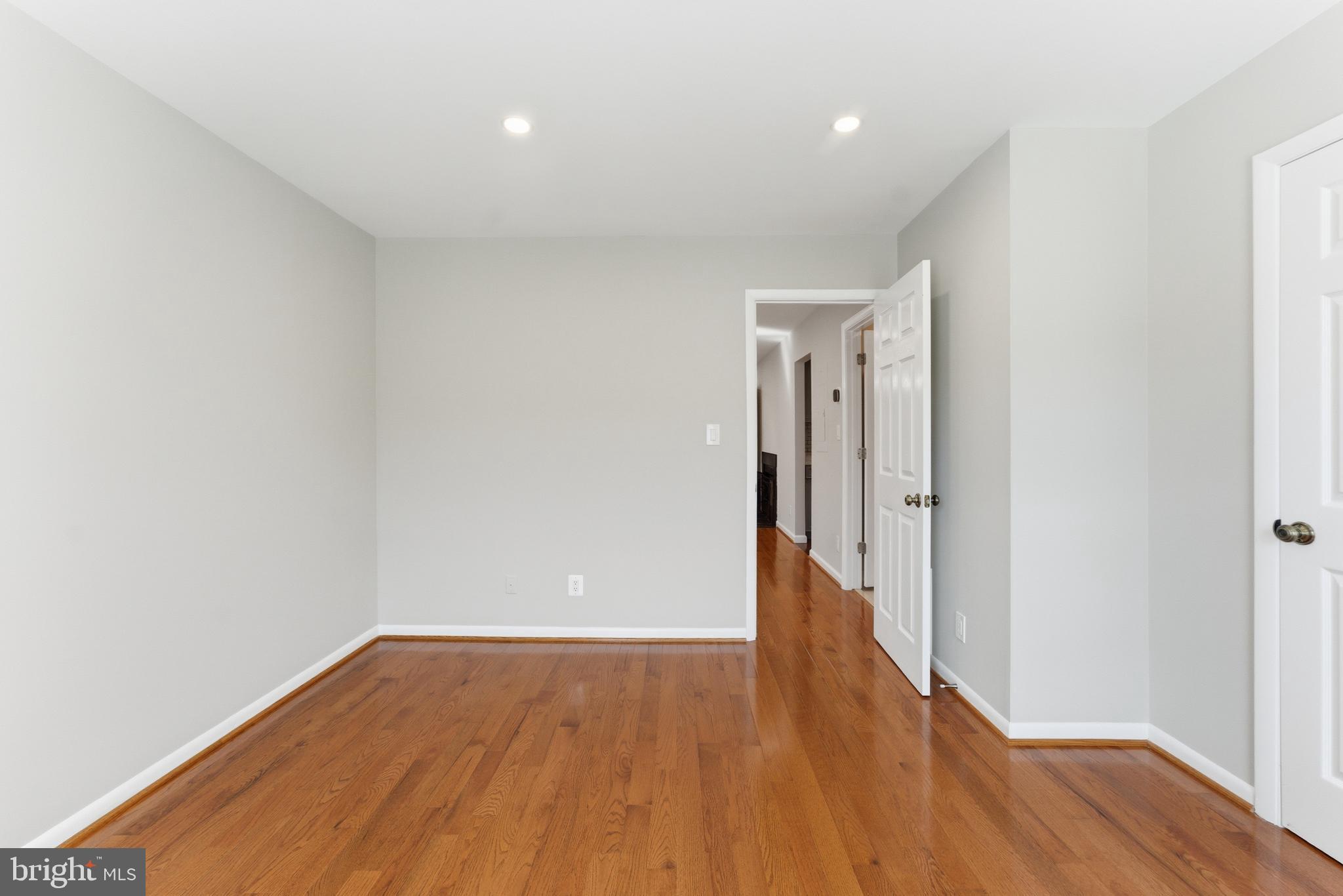 13406 Shady Knoll Drive, Unit 305 Silver Spring, MD 20904 - Photo 28 of 37 a view of hallway with wooden floor
