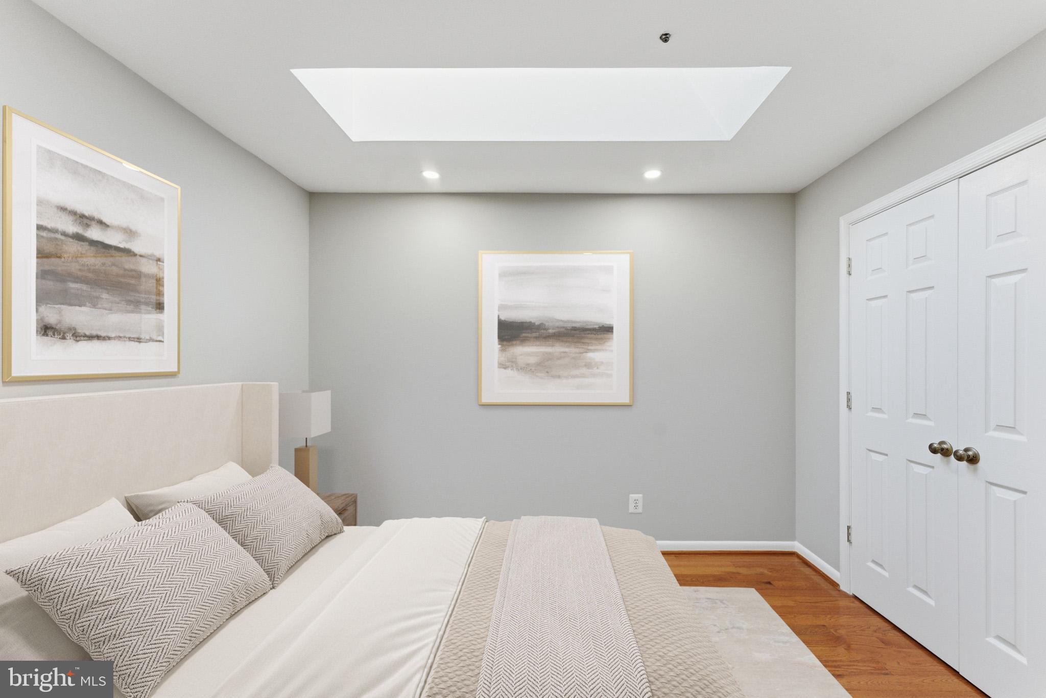 13406 Shady Knoll Drive, Unit 305 Silver Spring, MD 20904 - Photo 30 of 37 a bedroom with a bed and a window