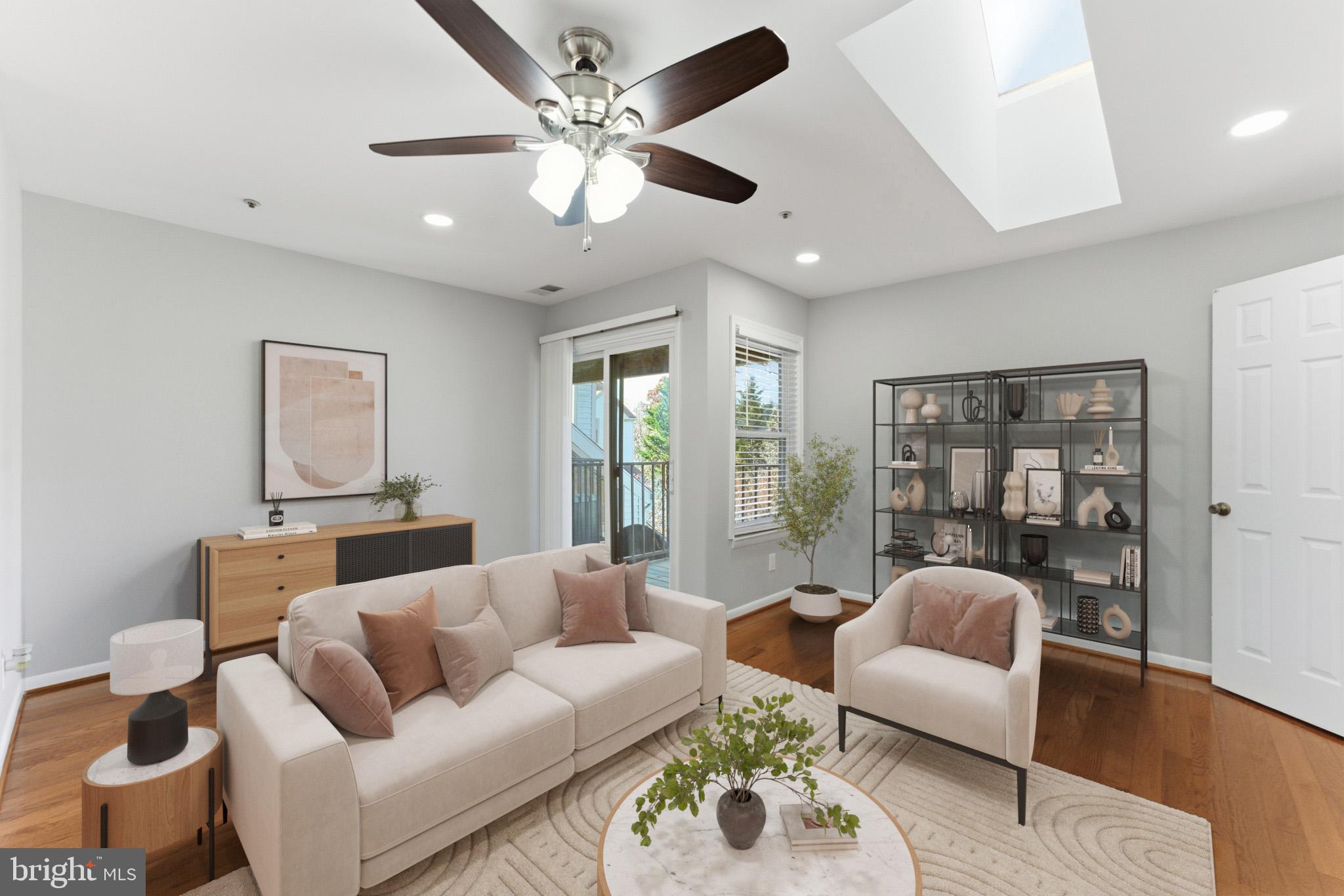 13406 Shady Knoll Drive, Unit 305 Silver Spring, MD 20904 - Photo 9 of 37 a living room with furniture and a large window