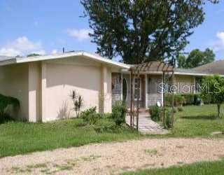 775 Kimball Road Venice, FL 34293 - Photo 1 of 1 a front view of a house with garden