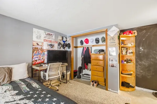 a view of a livingroom with workspace and a couch