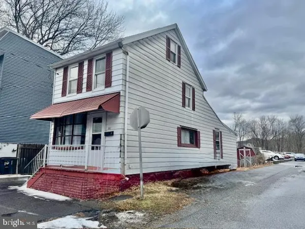 a front view of a house with a garage